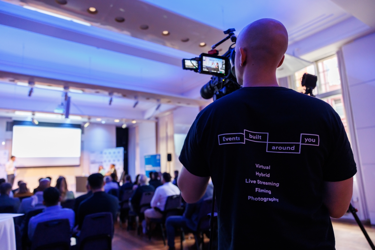 man-filming-event